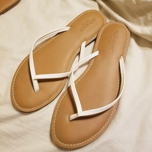 Old navy flip flops, tan base with white straps, 8